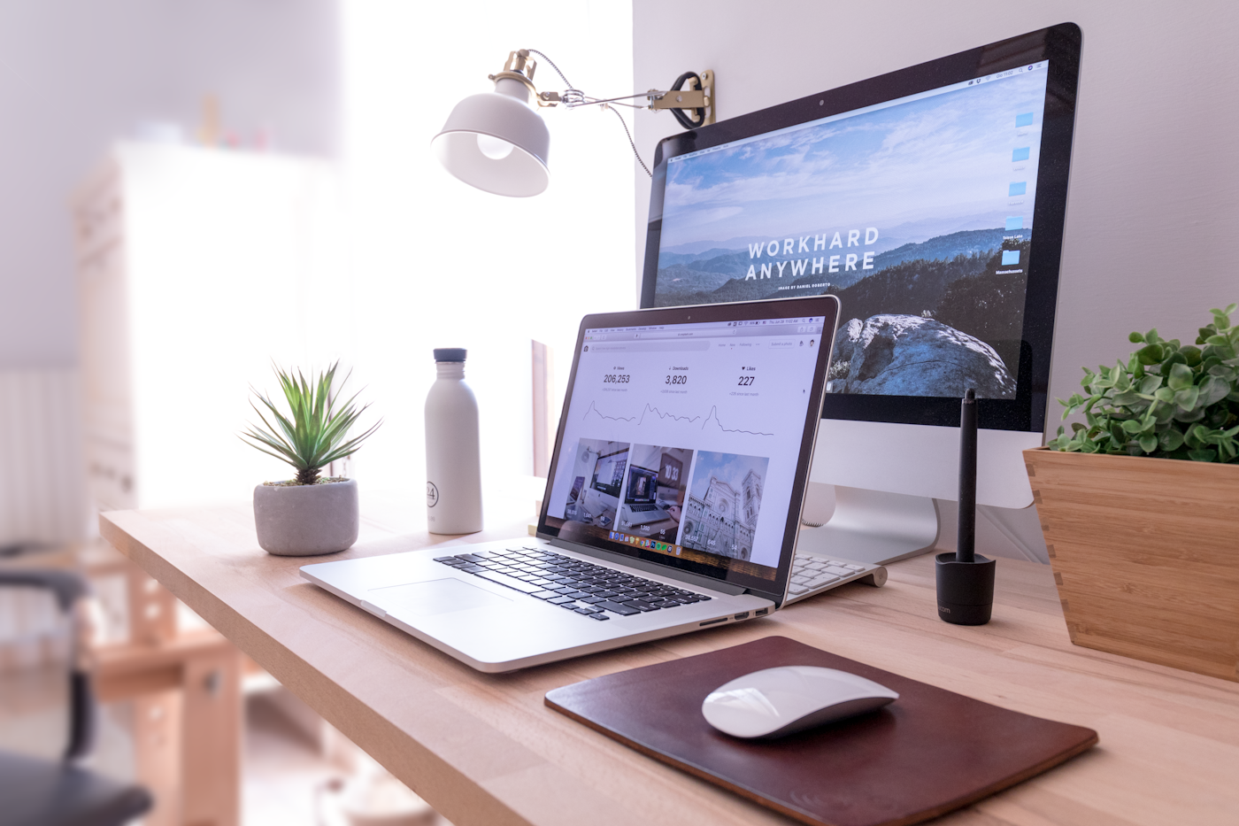 Bright workspace with laptop and desktop computer